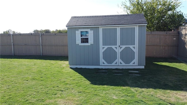 view of shed featuring a fenced backyard