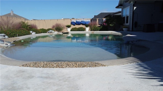 view of pool with fence and a fenced in pool