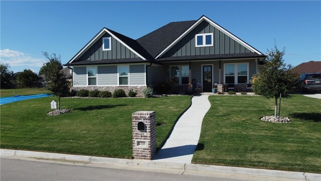 craftsman-style house with board and batten siding and a front yard