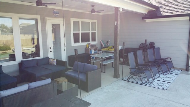 view of patio / terrace with ceiling fan and an outdoor living space