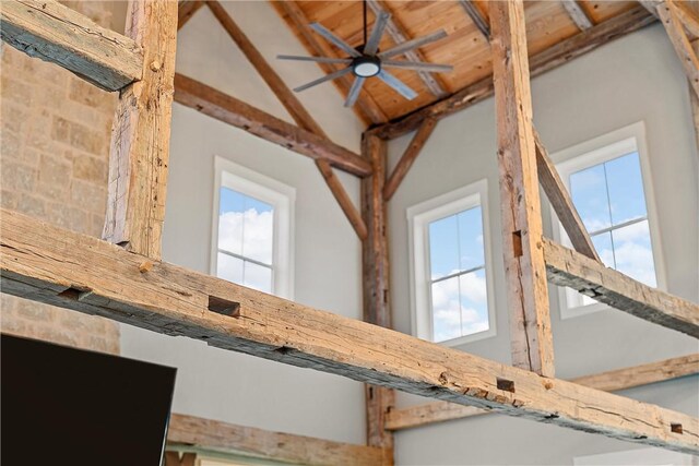 room details featuring ceiling fan and beamed ceiling