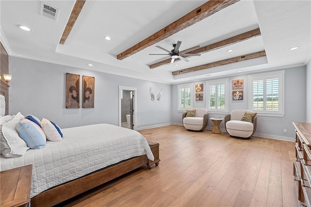 bedroom featuring light wood-type flooring, ceiling fan, ensuite bathroom, and multiple windows