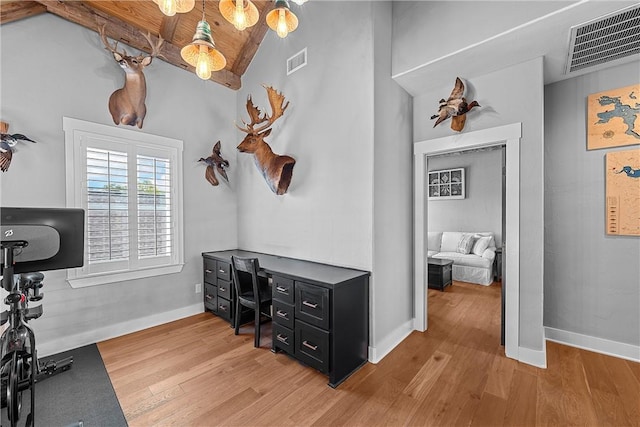 office featuring vaulted ceiling with beams and hardwood / wood-style floors