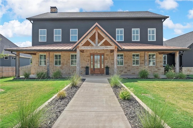 craftsman-style home with a front lawn