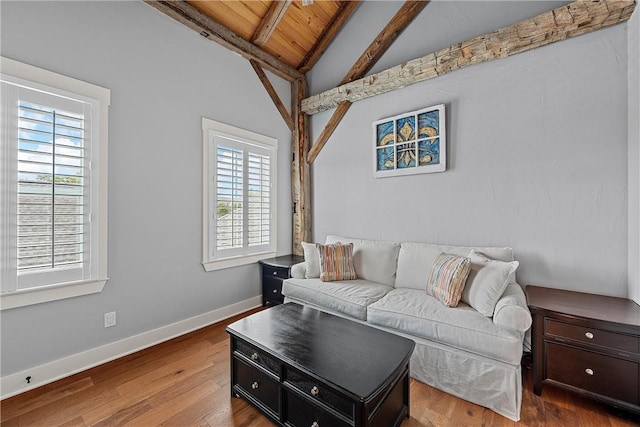 living room with vaulted ceiling with beams, wood-type flooring, and wooden ceiling