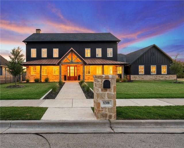 view of front of house with a lawn