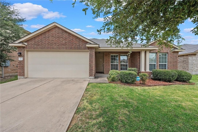 ranch-style home with a front yard and a garage