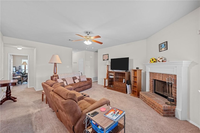 living room with carpet flooring, ceiling fan, and a fireplace