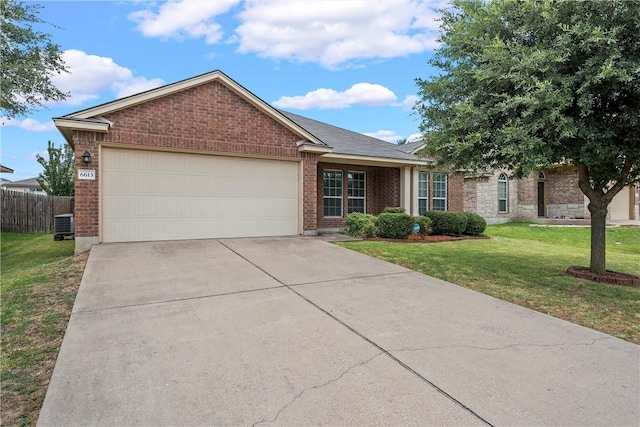 ranch-style house with a garage and a front yard