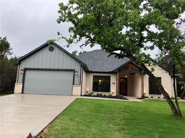 view of front of house with a garage and a front yard