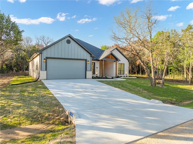 view of front of property with a garage and a front yard