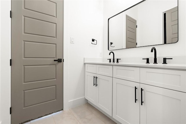 bathroom featuring tile patterned flooring and vanity