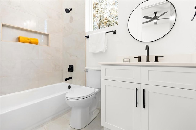 full bathroom with ceiling fan, tiled shower / bath combo, tile patterned flooring, toilet, and vanity