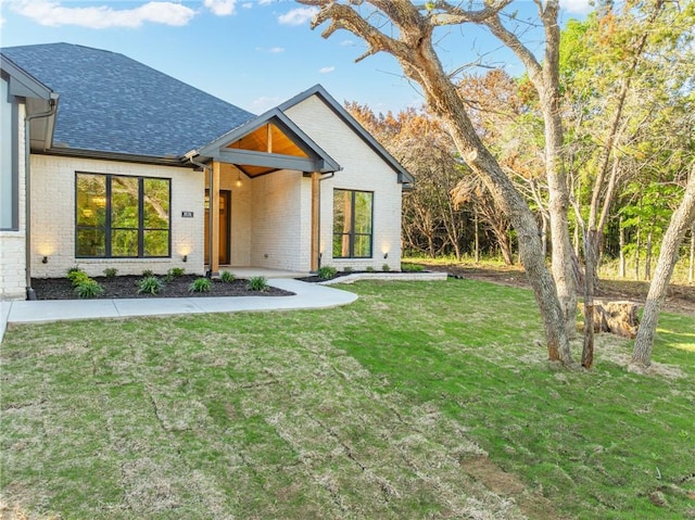 view of front of property with a front lawn