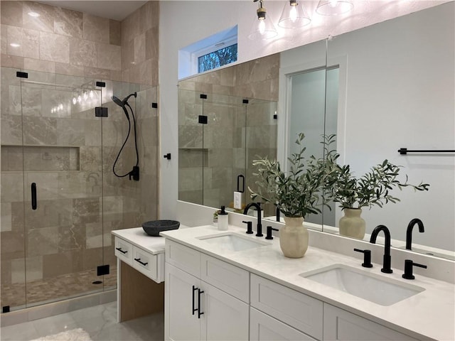 bathroom with vanity and an enclosed shower