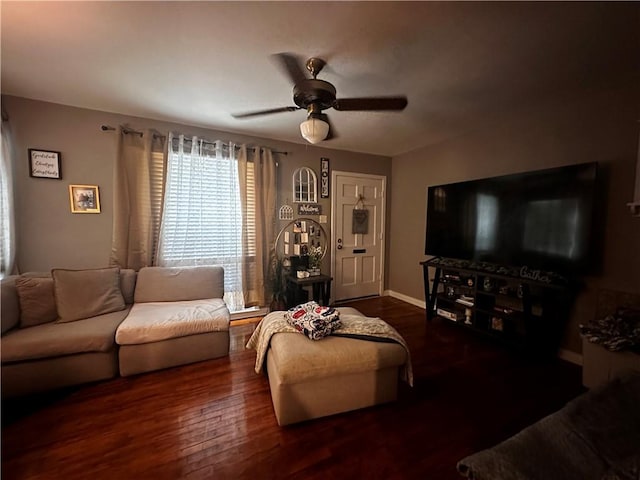 living room with ceiling fan and dark hardwood / wood-style flooring