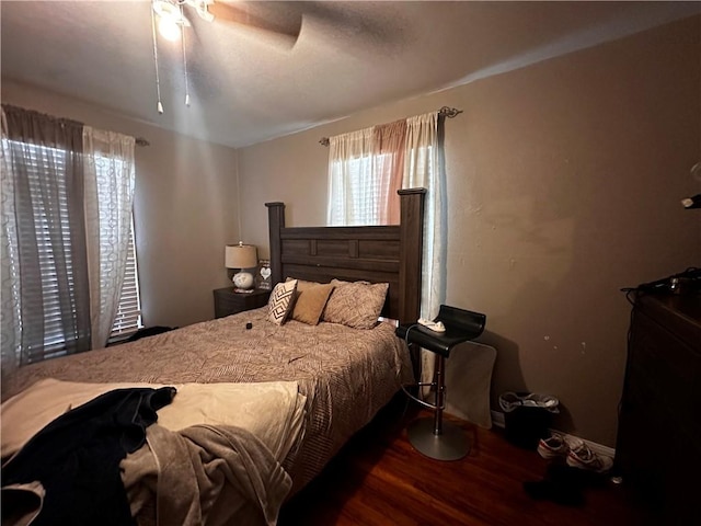 bedroom with hardwood / wood-style flooring and ceiling fan