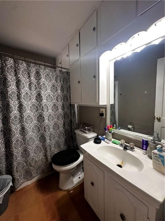 bathroom featuring vanity and toilet