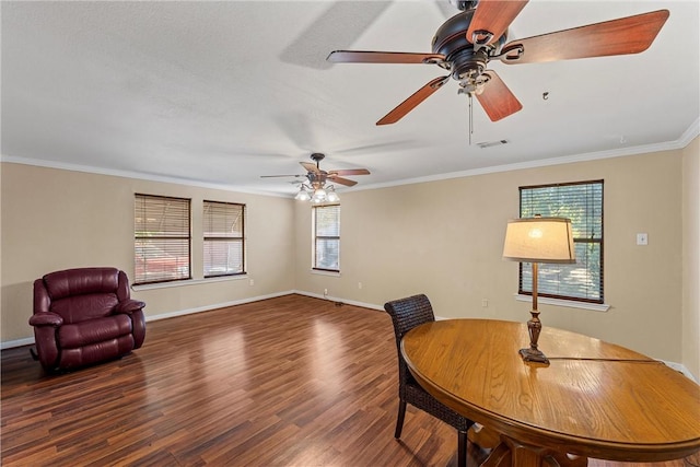 dining area with dark hardwood / wood-style flooring and ornamental molding