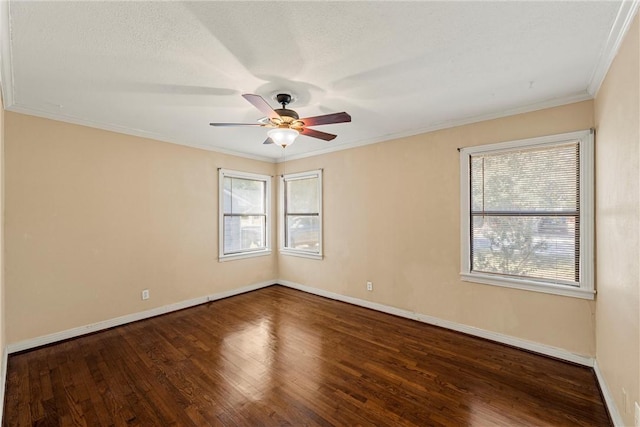 unfurnished room featuring ceiling fan, dark hardwood / wood-style flooring, a textured ceiling, and ornamental molding