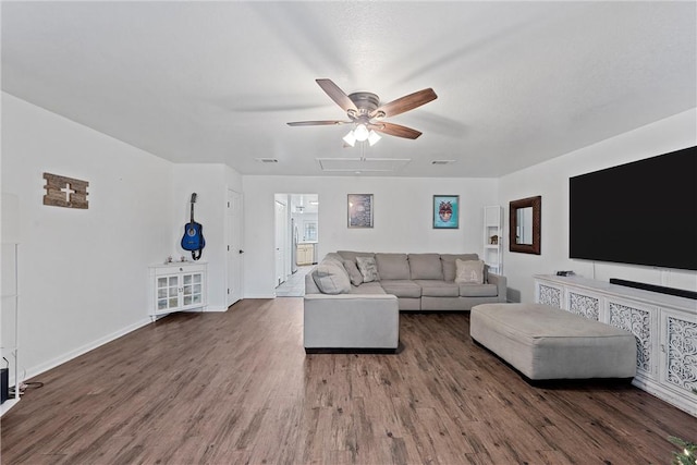 unfurnished living room featuring dark hardwood / wood-style floors and ceiling fan