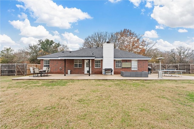 back of property featuring a patio area, a trampoline, and a yard