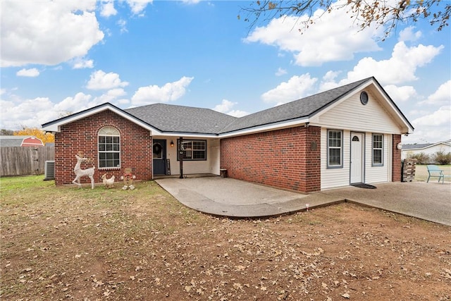 single story home featuring a patio area and cooling unit