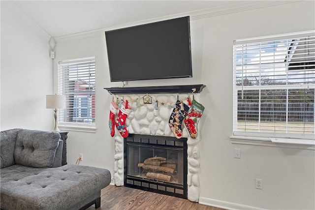 sitting room featuring hardwood / wood-style flooring, plenty of natural light, and ornamental molding