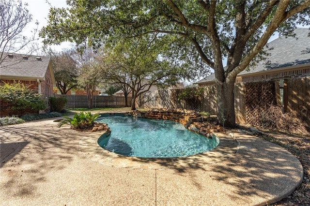 view of pool featuring a patio area, a fenced backyard, and a fenced in pool