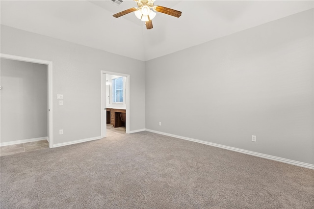 carpeted spare room with ceiling fan