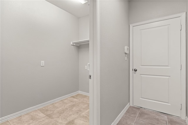 washroom with light tile patterned flooring