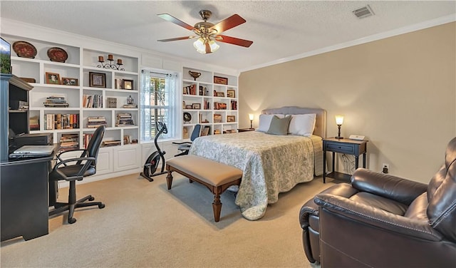 carpeted bedroom featuring ceiling fan, crown molding, and a textured ceiling