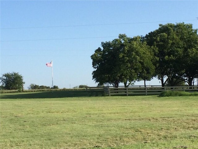 view of yard with a rural view