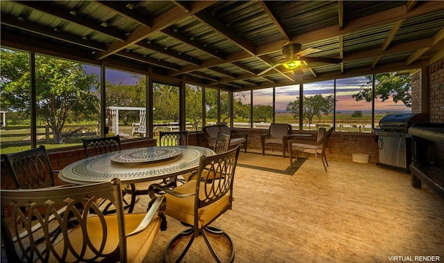 sunroom with beamed ceiling and ceiling fan