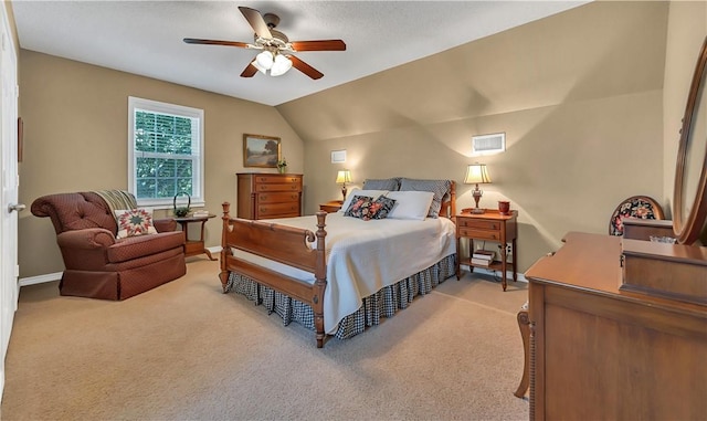 bedroom with ceiling fan, light colored carpet, and lofted ceiling