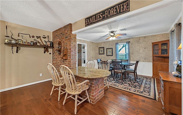 dining space featuring ceiling fan, dark wood-type flooring, and a textured ceiling