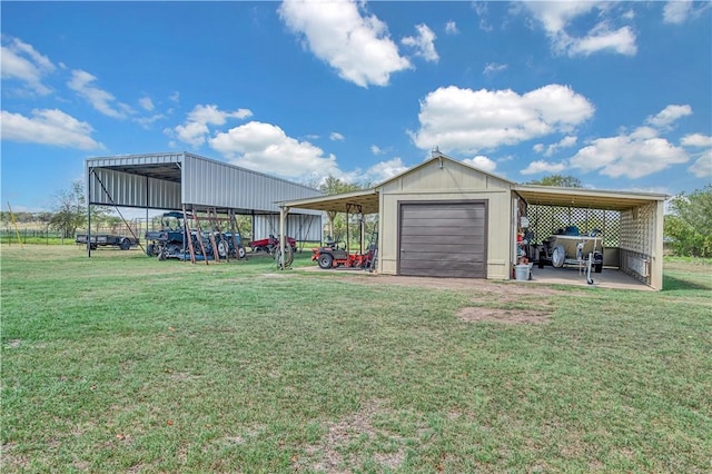 exterior space with an outbuilding, a carport, and a garage