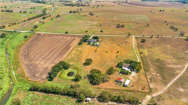 birds eye view of property with a rural view