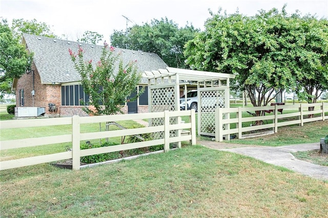 view of front of property with a front yard and a carport