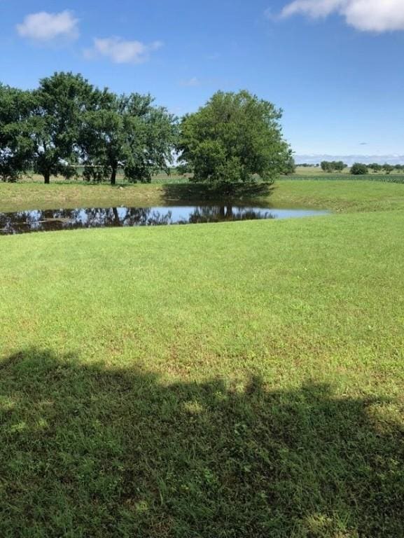 view of yard with a water view