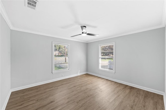 unfurnished room featuring ceiling fan, a healthy amount of sunlight, wood-type flooring, and crown molding