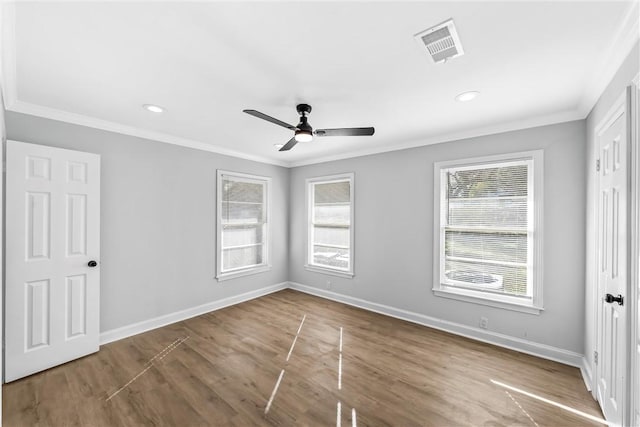 spare room featuring ceiling fan, crown molding, and hardwood / wood-style flooring