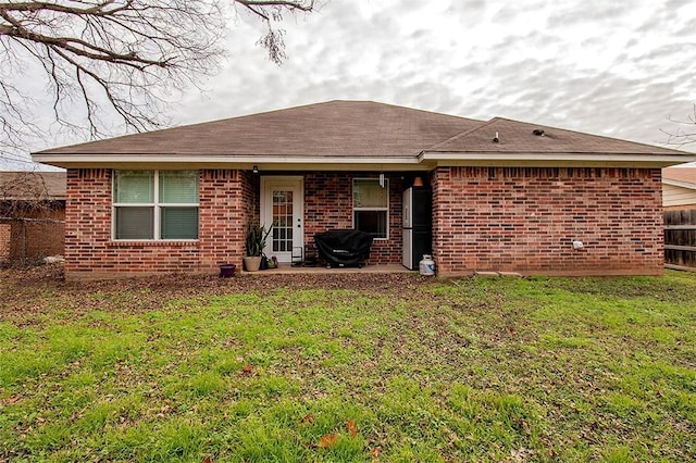 back of house with a yard