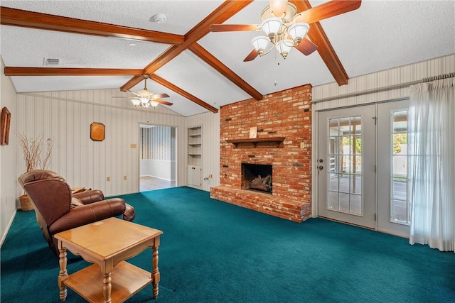 carpeted living room featuring ceiling fan, a fireplace, lofted ceiling with beams, and a textured ceiling