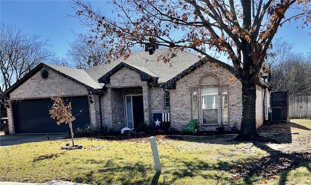 french country inspired facade with a front lawn and a garage