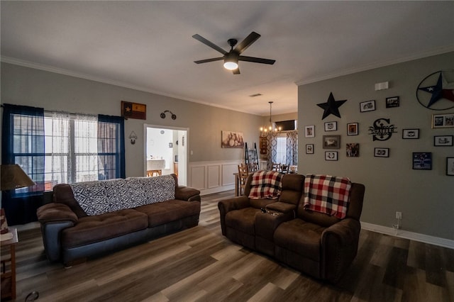 living room featuring crown molding, ceiling fan with notable chandelier, and hardwood / wood-style flooring