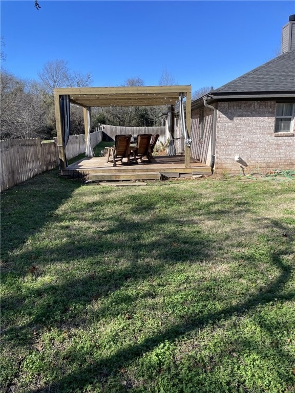 view of yard with a pergola and a deck