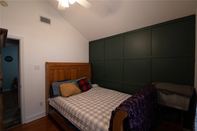 bedroom featuring ceiling fan, vaulted ceiling, and dark hardwood / wood-style floors