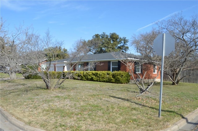 ranch-style house with a front lawn