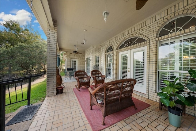 view of patio / terrace with french doors and ceiling fan